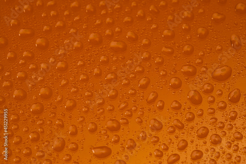Water Drops On Orange Background Texture colorful waterdrop.