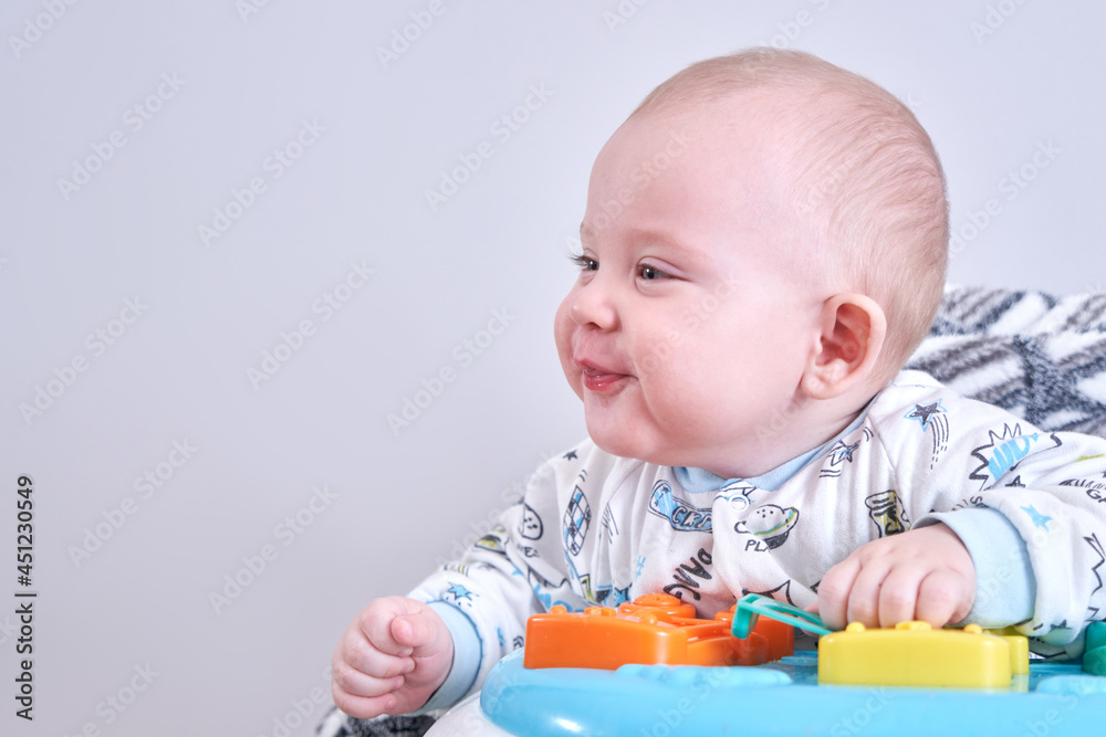 Portrait of happy toddler in baby walker at home Portrait of happy toddler in baby walker at home