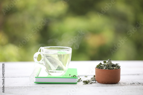 Pandan tea and leaves piles with notebook