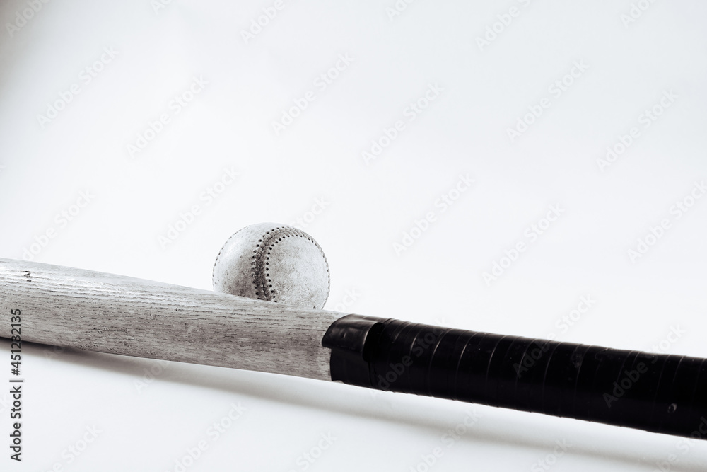 Wood baseball bat and ball on white background. Wood baseball bat and ball on white background.
