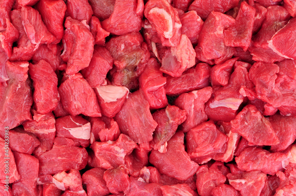 Fresh raw cubes of lean beef steak red meat background Fresh raw cubes of lean beef steak red meat background