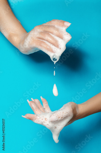 Woman with soap foam on hands photo