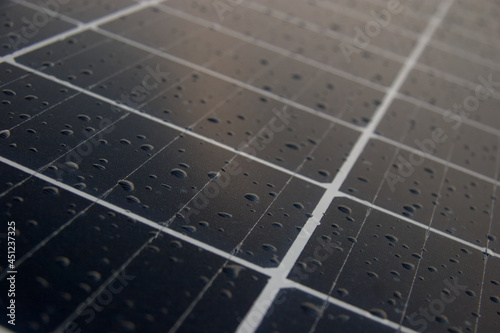 Macro of a solar panel with rain drops on its surface