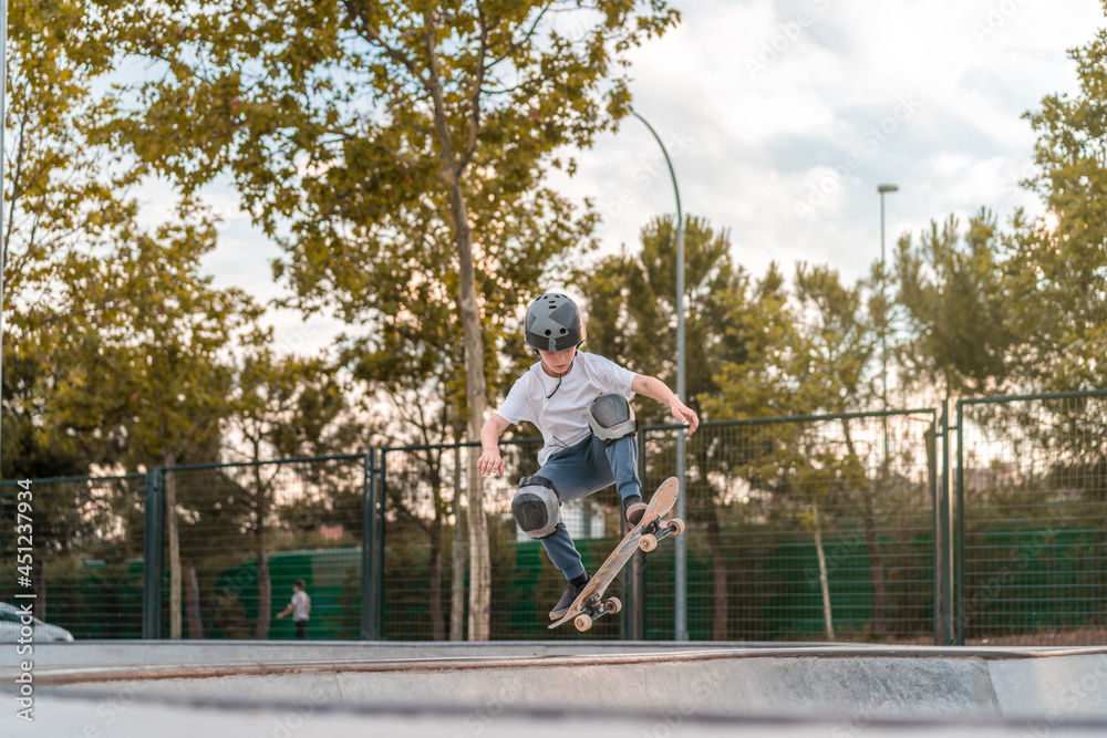 Skater performing trick on ramp in skate park Skater performing trick on ramp in skate park