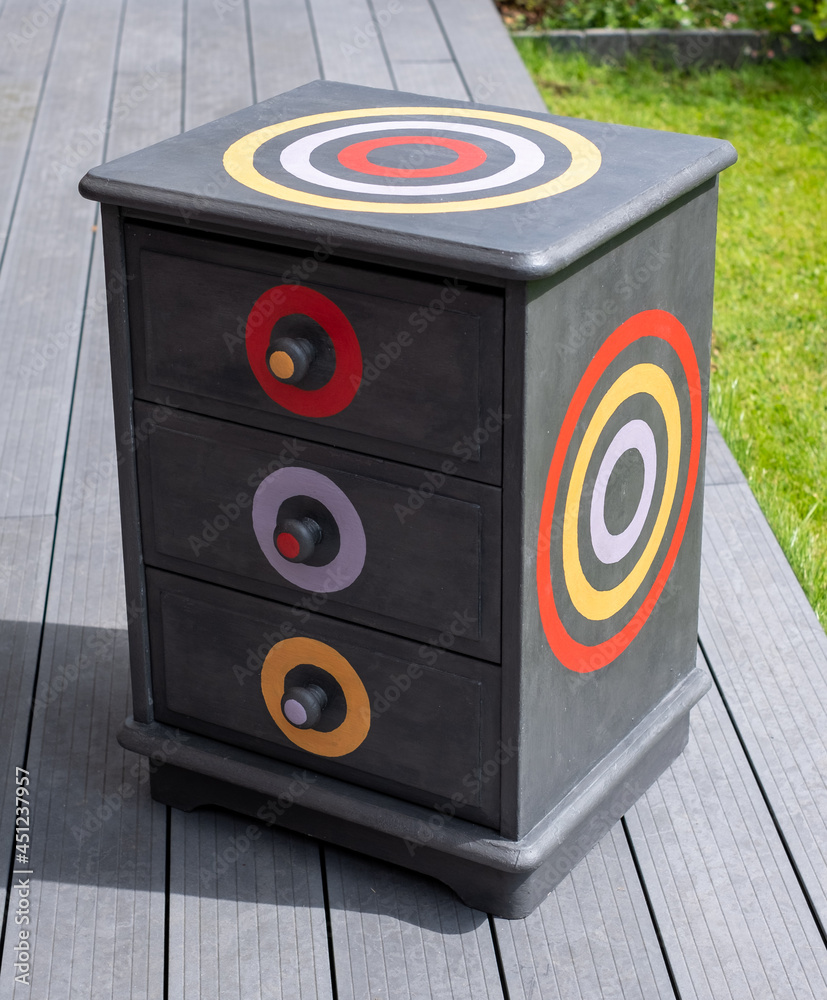 Dark grey painted bedside table with three drawers that has been