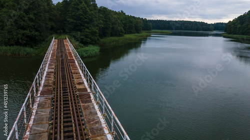Wallpaper Mural Iron steel frame construction of narrow gauge railway bridge across the river or lake. Bridge with the narrow gauge railway. Aerial view. Space for text. Torontodigital.ca