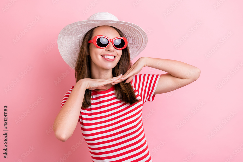Photo of sweet young brunette lady hands face wear eyewear cap striped t-shirt isolated on pink color background Photo of sweet young brunette lady hands face wear eyewear cap striped t-shirt isolated on pink color background