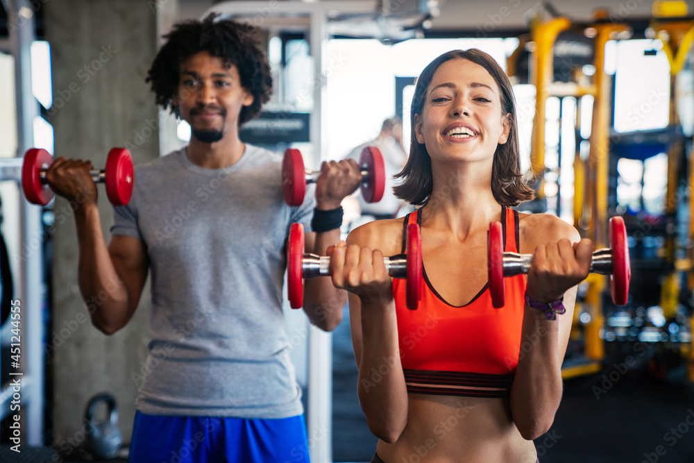 Picture of cheerful fitness team exercise together in gym Picture of cheerful fitness team exercise together in gym