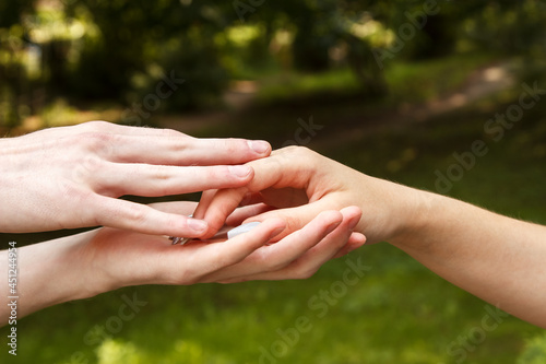 man and woman hold hands. hands closeup