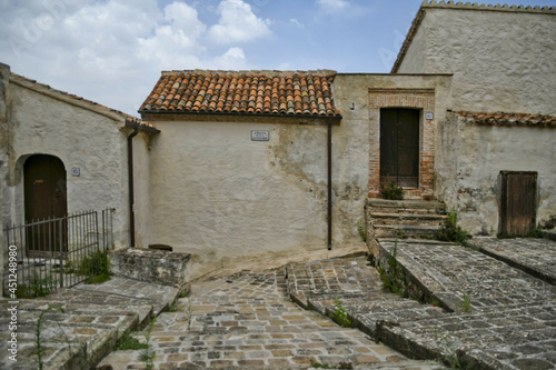 The facade of an old house in the historic center of Aliano, a medieval town in the Basilicata region, Italy.