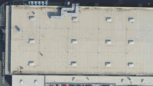 Big drone flying over a roof to inspect and measure it photo