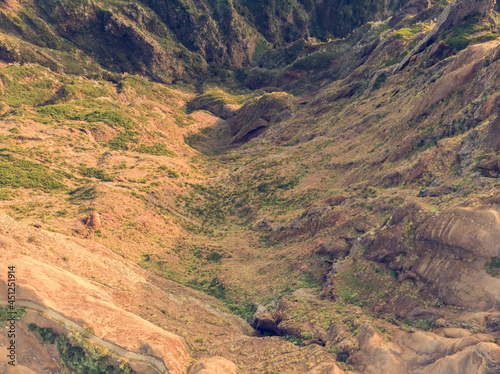 Drop down view of trail following volcanic mountain ridge.