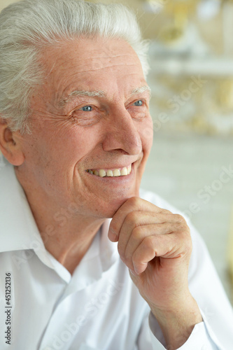 Close up portrait of smiling senior man