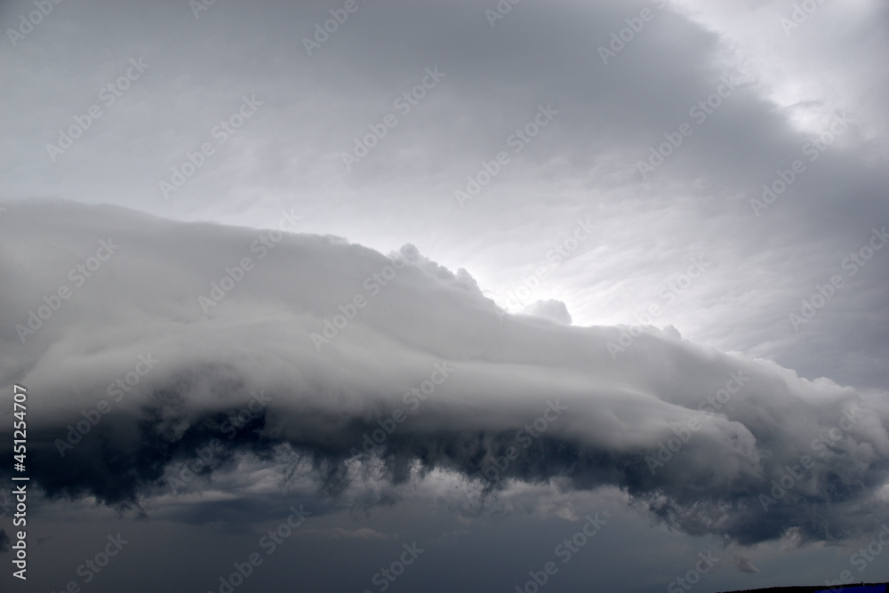 Storm hurricane blue leaden torn clouds on the horizon