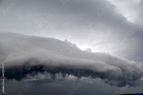 Fototapeta Storm hurricane blue leaden torn clouds on the horizon