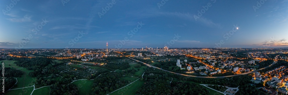 Drone panorama over Frankfurt skyline in evening light taken from Niddapark