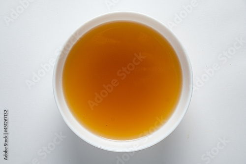boiled meat broth with scented water and vegetables photo