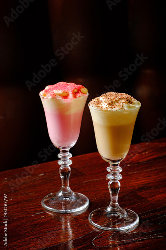 two cocktails on the wooden background
