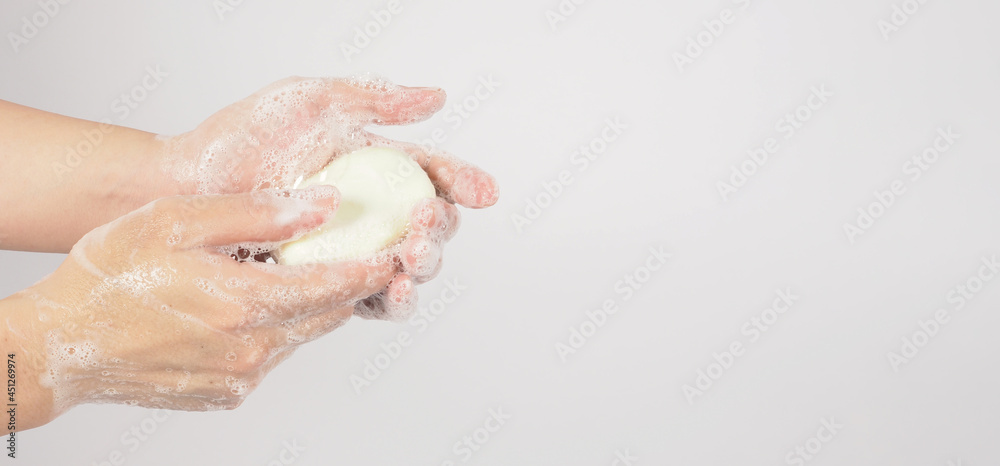 Hands washing gesture with bar soap and bubble on white background. Hands washing gesture with bar soap and bubble on white background.