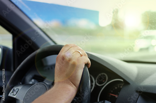 Wallpaper Mural hand is holding the steering wheel to drive the car Torontodigital.ca