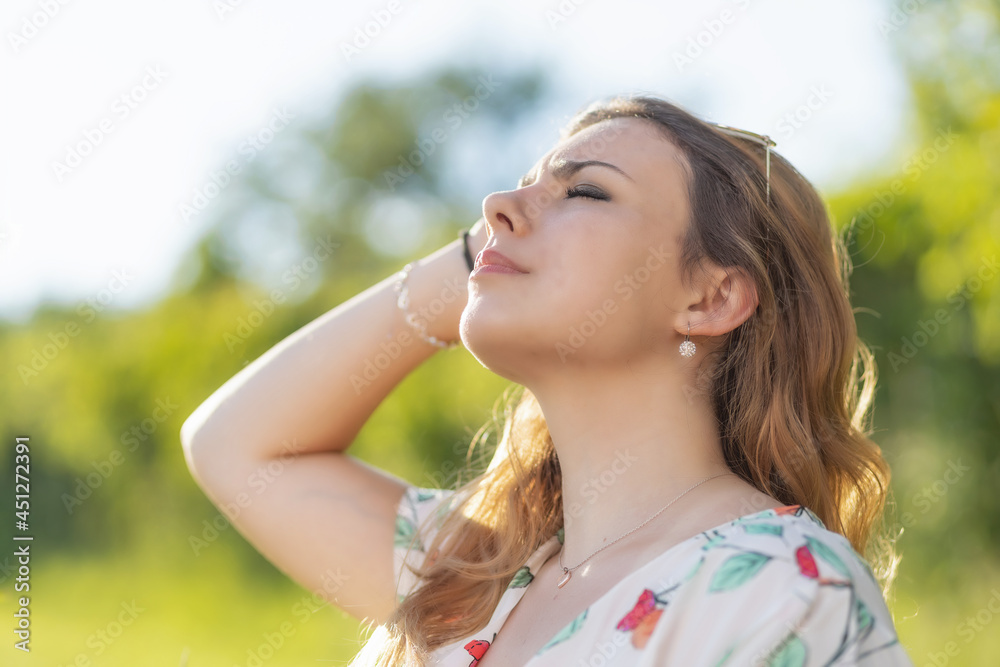 Side view of the face of sunbathing beautiful young woman. Horizontally. Side view of the face of sunbathing beautiful young woman. Horizontally.