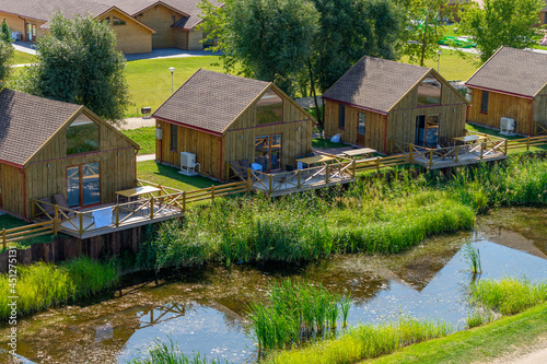 Wooden houses in Camping Dreverna. Lithuanian seaside near the Curonian Lagoon photo