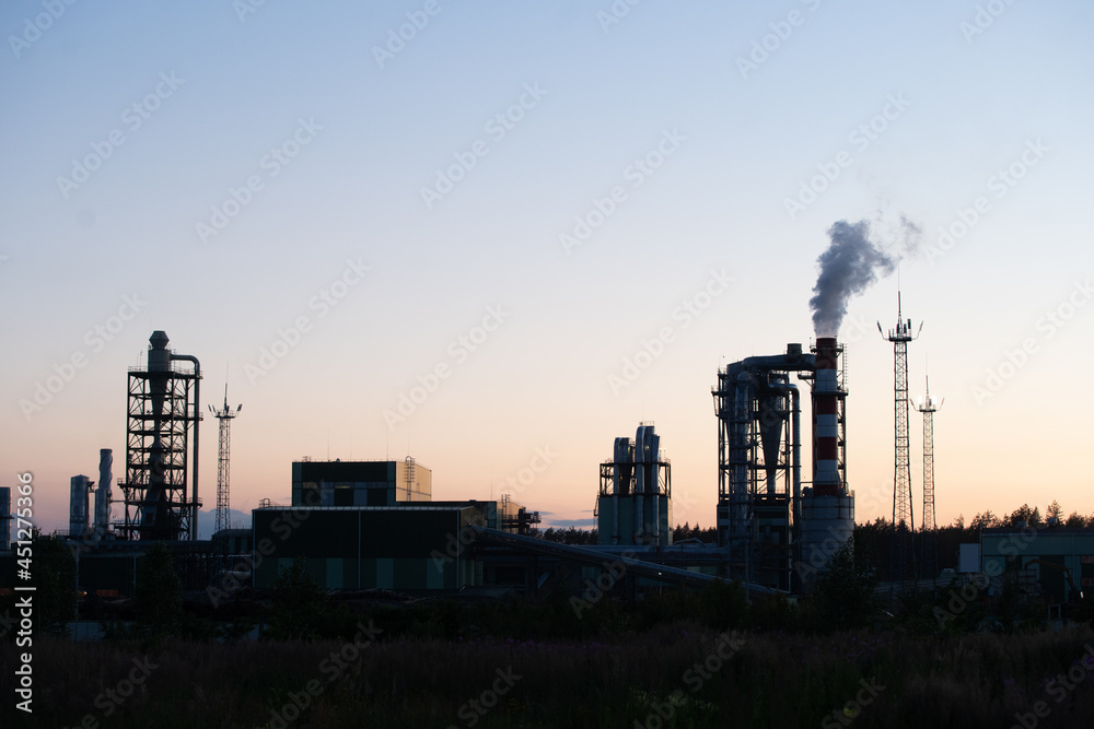 Fototapeta premium Factory pipe polluting air against sunset, environmental problems, smoke from chimneys.