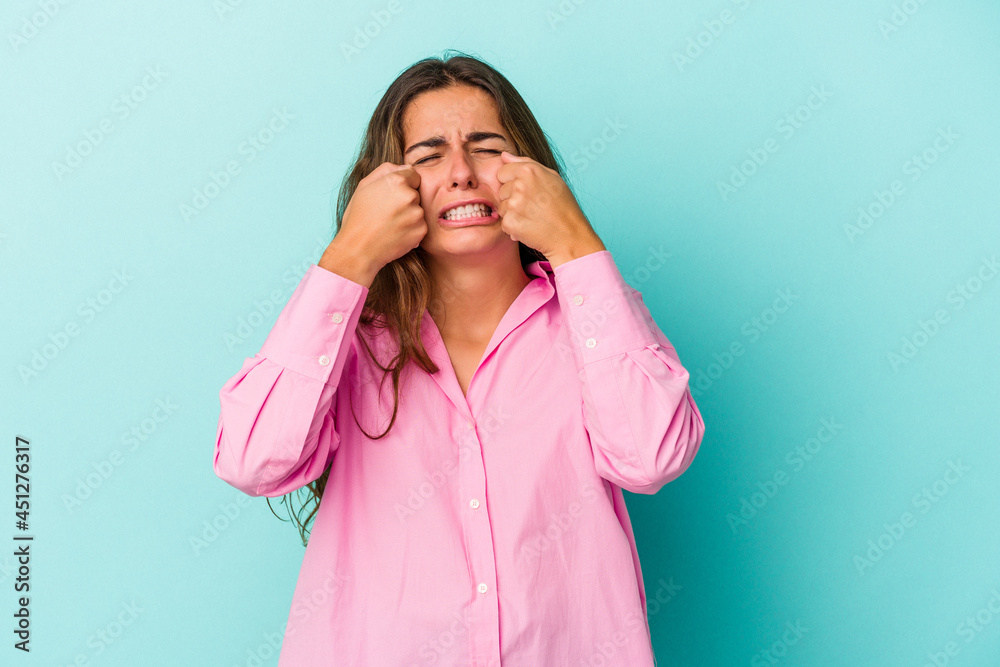 Young caucasian woman isolated on blue background whining and crying disconsolately. Young caucasian woman isolated on blue background whining and crying disconsolately.