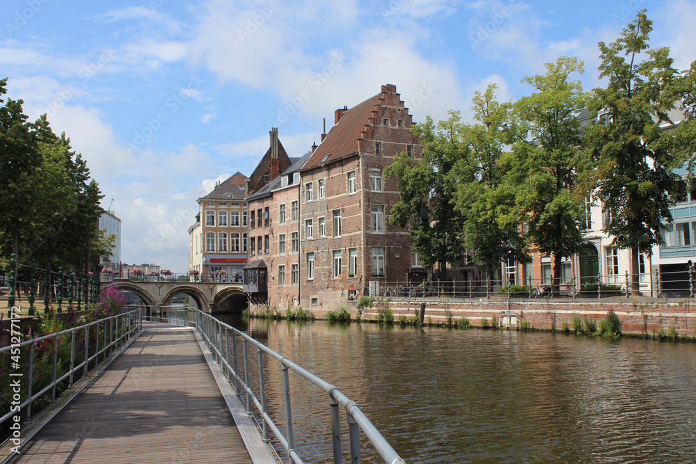 Naklejka premium View of the River Dijl and and surrounding historic buildings near 'Grootbrug' in Mechelen, Antwerp province, Belgium.
