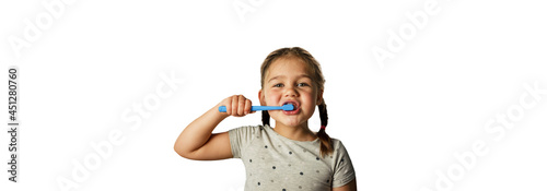 isolated. girl brushes her teeth with a toothbrush on a white background.