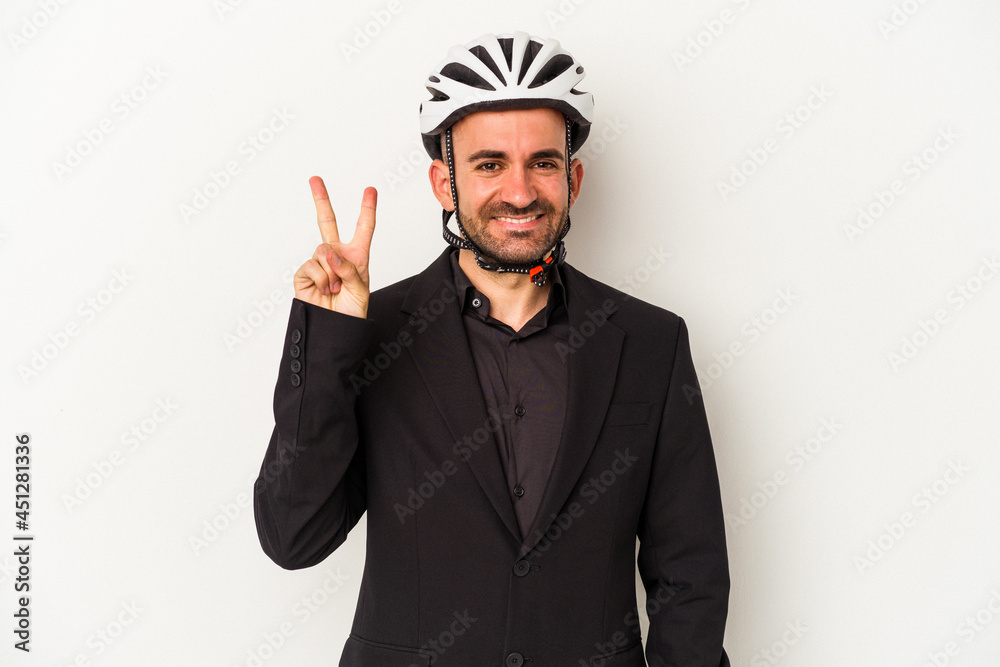 Young business bald man wearing a bike helmet isolated on white background showing number two with fingers. Young business bald man wearing a bike helmet isolated on white background showing number two with fingers.