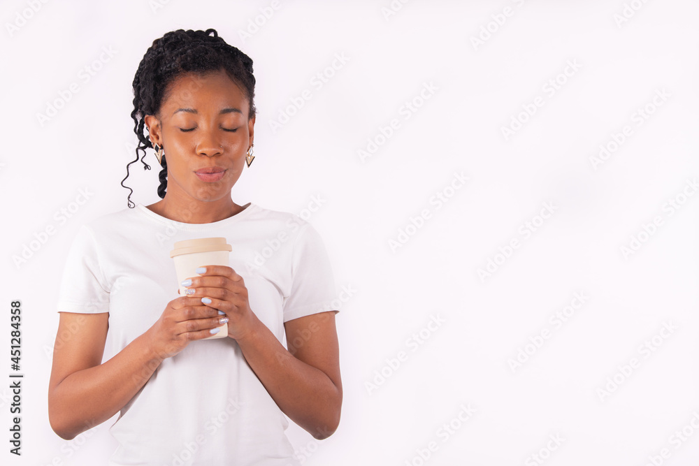 Afro american woman holding a paper cup doing a kissing gesture Afro american woman holding a paper cup doing a kissing gesture