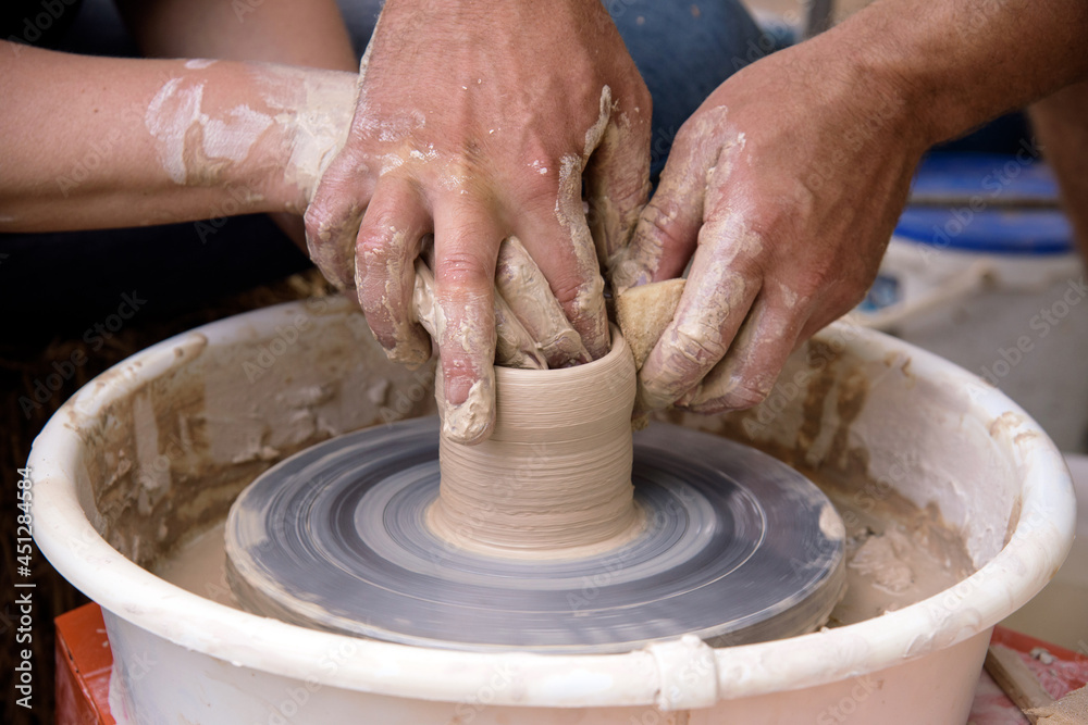 workshop of ukrainian traditional handmade ceramic pots on the wheel