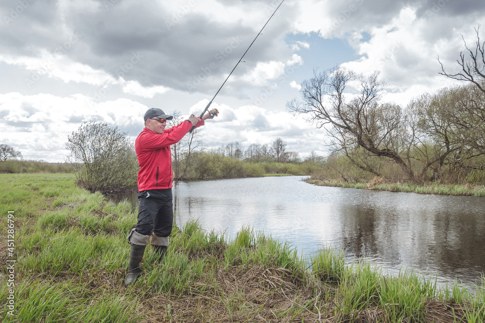 Fisherman on the banks of a picturesque river. Fisherman on the banks of a picturesque river.