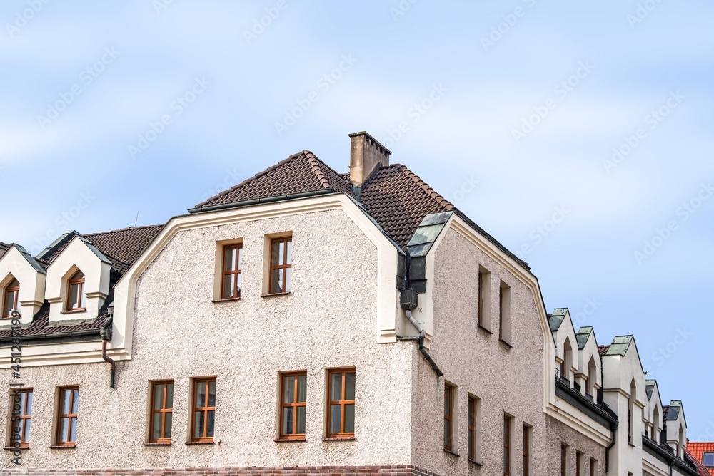 Facade of an old residential building on the street of the city, the historical center of Poland Facade of an old residential building on the street of the city, the historical center of Poland
