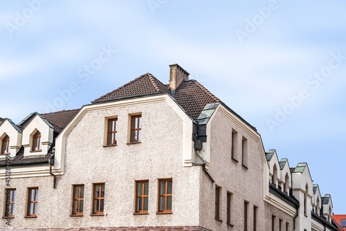 Facade of an old residential building on the street of the city, the historical center of Poland