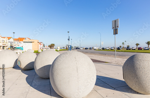 a street decorated with concrete balls at Costa Nova do Prado, Gafanha da Encarnacao, Municipality of Ilhavo, district of Aveiro, Portugal