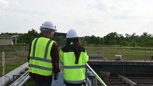 Wallpaper Mural Environmental engineers work at wastewater treatment plants,Water supply engineering working at Water recycling plant for reuse,Technicians and engineers discuss work together.
 Torontodigital.ca