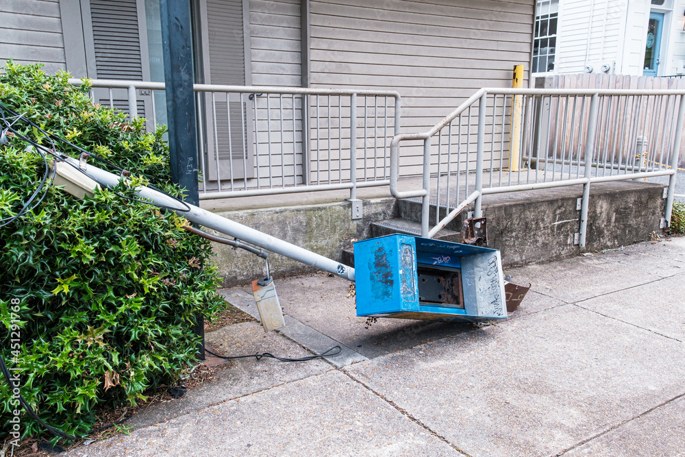 Fallen Phoneless Pay Phone Stand on Sidewalk Fallen Phoneless Pay Phone Stand on Sidewalk