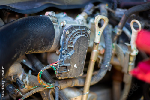 The insides of the car under the hood. Wires, hoses that make up auto parts, selective focus