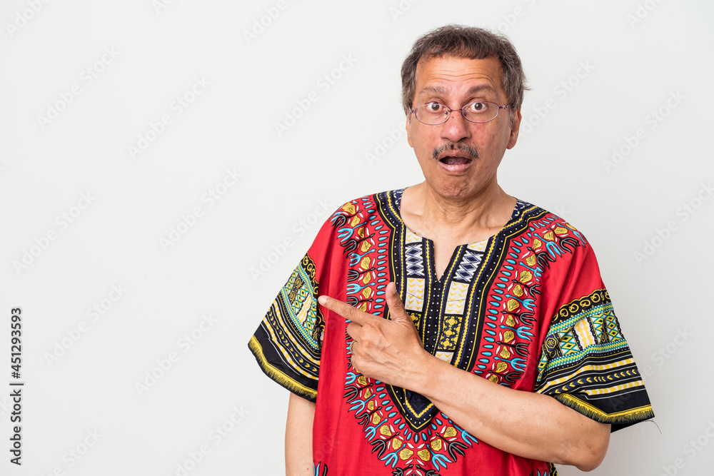 Senior indian man wearing a Indian costume isolated on white background pointing to the side Senior indian man wearing a Indian costume isolated on white background pointing to the side
