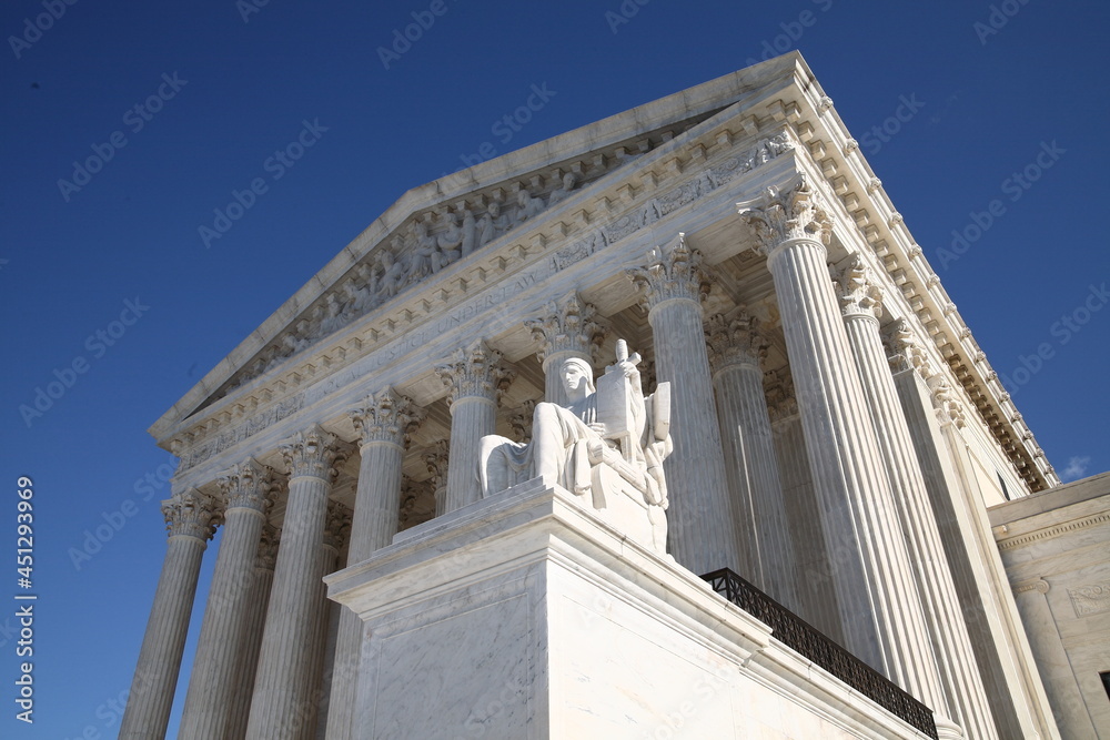 Supreme court shot from an angle with blue sky above