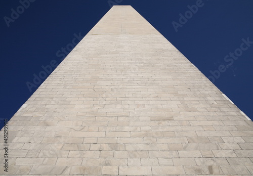 Worm's eye view of the Washington Monument looking up into blue sky