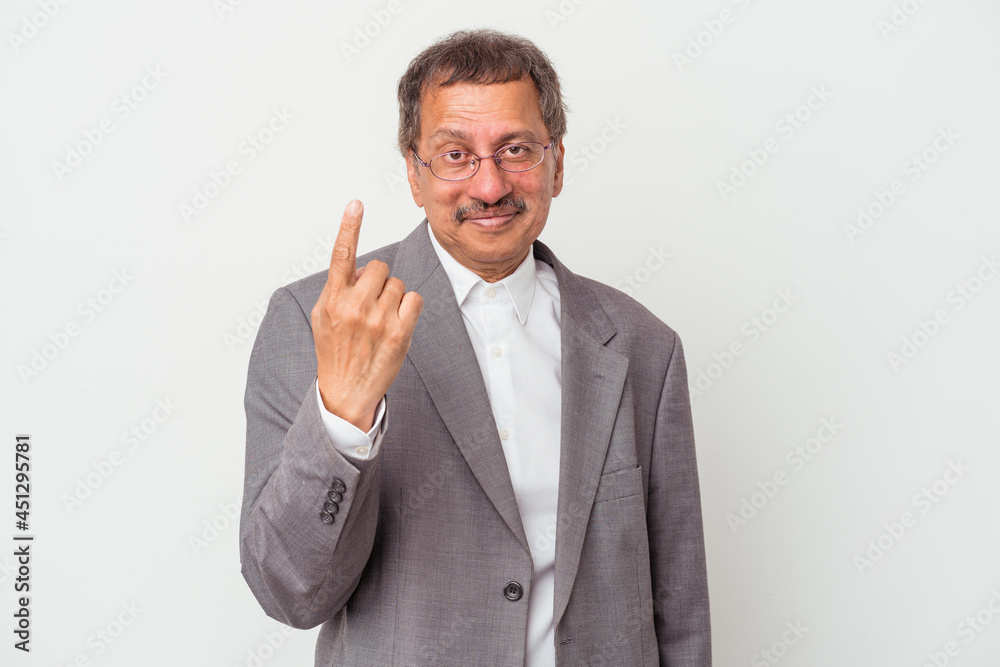 Middle aged indian business man isolated on white background pointing with finger at you as if inviting come closer. Middle aged indian business man isolated on white background pointing with finger at you as if inviting come closer.