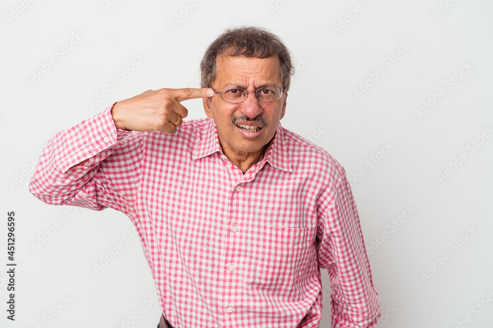 Middle aged indian man isolated on white background showing a disappointment gesture with forefinger. Middle aged indian man isolated on white background showing a disappointment gesture with forefinger.