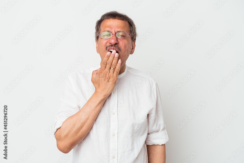 Middle aged indian man isolated on white background yawning showing a tired gesture covering mouth with hand. Middle aged indian man isolated on white background yawning showing a tired gesture covering mouth with hand.