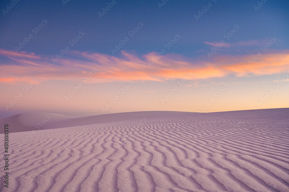 Rippling Sand Dune Stands Untouched At Sunset