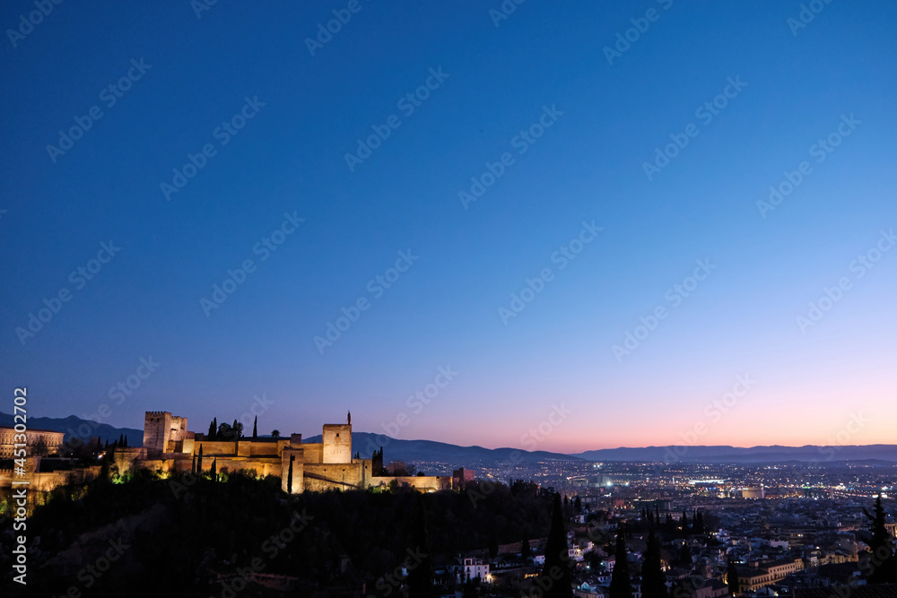 Night view of the city of Granada with the Alhambra in the center of the photo
