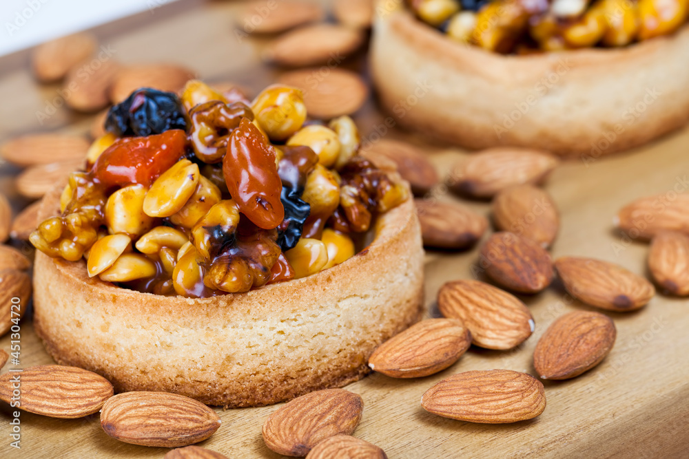 tartlets made of dough nuts and dried fruits tartlets made of dough nuts and dried fruits