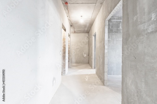 interior of the apartment without decoration in gray colors © gluschenkoart